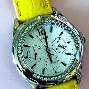 GUESS ladies watch. Near perfect condition. Yellow alligator leather band.